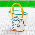 Bolso de playa transparente de PVC con osito, asas amarillas y diseño colorido para compras. - Talla Única / Oso Bueno