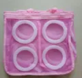 Detailed view of the pink mesh shoe washing bag with internal circular support rings for laundry. - Pink