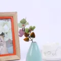 Artificial flower branch with colorful simulation leaves in small ceramic vase for home decor. - Style 5