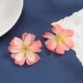 Close-up detail of artificial silk flower heads, gradient pink multi-layered wedding decor. - Style 10