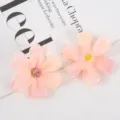 Detailed close-up of pink artificial silk flower heads, perfect for DIY crafts and wedding decor. - Style 12