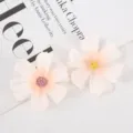 Close-up detail of artificial silk flower heads featuring delicate pink petals for DIY crafts. - Style 19