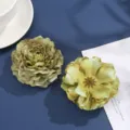 Close-up detail of artificial fabric peony flower heads in green tones for DIY accessories. - 21#