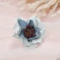 Close up of elegant blue white fabric camellia artificial flower head for home wedding decor. - Style 5