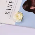 Detailed close-up shot of an artificial white rose flower head, perfect photography prop. - Style 12