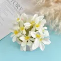 Close-up of white artificial silk flower heads with yellow stamens for DIY props. - Style 7