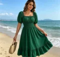 Detailed view of the green square neck puff sleeve midi dress, perfect for summer beach style. - Green