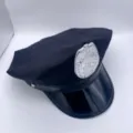 Sombrero de disfraz de policia negro para adulto con insignia plateada, accesorio variante. - Talla única / Gorra octogonal negra con insignia de águila plateada