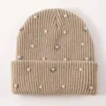 Detail view of winter warm knitted beanie hat embellished with pearls and sparkling rhinestones. - One Size / Khaki