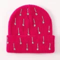 Close up of bright pink knit beanie featuring sparkling rhinestone teardrop decorations. - One Size / Rose Red