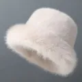 Close-up detail of the fluffy faux fur bucket hat, showing soft plush texture and winter warmth. - Adjustable / Beige