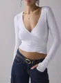 White long sleeve wrap V-neck slim top detail, elegant crossover waist design and ribbed texture. - S / White
