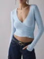 Light blue cross wrap V-neck long sleeve slim fit crop top detail view, casual chic style. - S / Light Blue