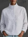 Detailed view of white floral embroidered stand collar long sleeve blouse with button placket. - S / White