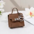 Mini braune Leder Taschenanhänger Schlüsselanhänger, süße Vintage Münztasche Halter. - Braun