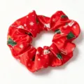 Red Christmas scrunchie with festive snowflake and tree print for holiday hair styling. - Red