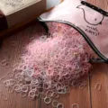 Detailed shot of colorful disposable hair rubber bands for girls, elastic hair ties. - 1000 Pieces/Pack / Jelly Color