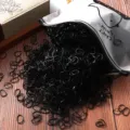 Bulk pack of black disposable rubber hair bands for kids, stretchy ponytail elastics. - 1000 Pieces/Pack / Black