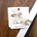 Close-up detail of cute Korean style bow hair clips with pearls, crystals, and lace. - Heart Bowknot Hair Clip
