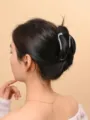 Close-up shot of elegant black acrylic hair claw clip styling on woman back head. - Banana Claw Clip / 10cm / Black