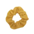 Detailed view of the soft yellow cotton scrunchie, perfect for daily casual hairstyles. - Yellow