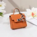 Mini orange Handtasche Schlüsselanhänger kleine Portemonnaie aus Leder mit Schloss. - Orange