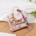 Mini rosa Rosenmuster Handtasche Schlüsselanhänger, süße Münztasche mit Metallverschluss Tuch. - Rosenrosa