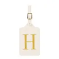 Vue détaillée d'une étiquette de bagage en cuir blanc crème avec broderie dorée lettre H. - Lettre H / Blanc Cassé