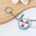 Mini monedero redondo de piel con bonito diseño de salvavidas y gancho metálico. - Estilo Fútbol/Salvavidas / Fútbol americano