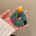 Cozy autumn winter wool wrapped hair scrunchie with colorful yarn pom poms cute elastic hair tie - Green