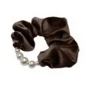 Close up detail view of the elegant dark brown velvet pearl scrunchie hair accessory. - Brown