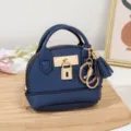 Mini blaue Kuppel Handtasche Muenzgueltche mit goldenem Schloss Quasten Schluesselanhaenger. - Dunkelblau