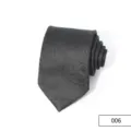 Detailed view of men's black business tie featuring classic retro paisley jacquard pattern, polyester. - Color 006