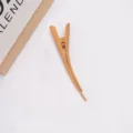 Large matte duckbill hair clip close-up showing textured finish and secure grip design. - Goose Yellow