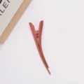 Large matte duckbill hair clip detail shot, elegant Morandi design for secure styling. - Watermelon red