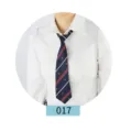 Detailed view of the dark blue jk uniform tie with red and white oblique stripes and crown patterns. - 017