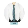 Detail view of the green and blue striped JK uniform tie featuring a small crest embroidery. - Green 003