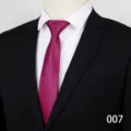 Close-up detail of a classic blue formal business tie with red geometric pattern for men. - Color 007