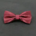 Detailed view of a stylish red and black plaid bow tie for men wedding and business suits. - Color 007