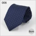 Detailed view of the 8cm navy blue business men's necktie featuring stylish blue dot woven pattern. - No. 006