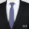 Detail shot of blue mens jacquard tie featuring small floral geometric pattern and 6cm width. - Blue with Pink White Floral