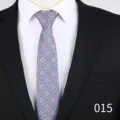 Detailed view of the exquisite floral jacquard necktie showing intricate pattern and texture. - Red with Blue Floral