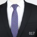 Close-up detail of a blue floral jacquard men's tie, professional suit matching accessory. - Blue with Red White Floral