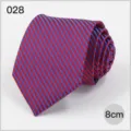 Detailed shot of a classic blue and red striped men's necktie featuring subtle white dots. - No. 028