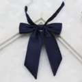 Navy blue fine textured fabric detail of JK uniform bow tie collar accessory closeup shot. - 003-Navy Blue