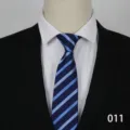 Detail view of the blue striped formal tie, showing clean fabric texture and classic pattern. - 011