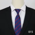 Close-up detail of the classic blue business tie with red diagonal stripes on mannequin. - Color 015
