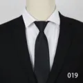 Men's formal business black tie paired with suit jacket and white dress shirt detail. - Color 019