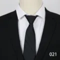Detail shot of a black business men's tie on a mannequin, professional formal wear. - Color 021