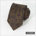 Close-up detail of a brown paisley necktie featuring intricate gold woven patterns for formal wear. - 5